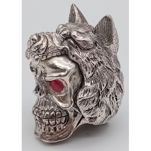 662 - Unusual novelty silver white metal vesta case in the form of a skull and wolf with ruby coloured eye... 