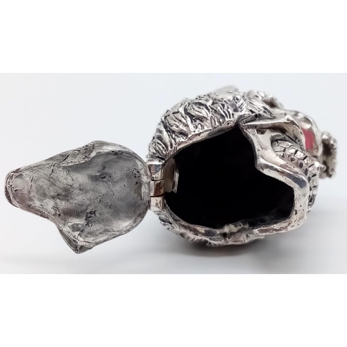 662 - Unusual novelty silver white metal vesta case in the form of a skull and wolf with ruby coloured eye... 