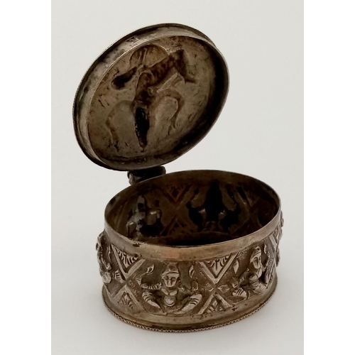 391 - An Antique Burmese Solid Silver Snuff or Pill Box. Wonderful embossing decoration throughout. Good c... 