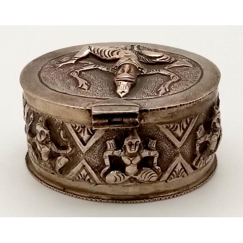 391 - An Antique Burmese Solid Silver Snuff or Pill Box. Wonderful embossing decoration throughout. Good c... 