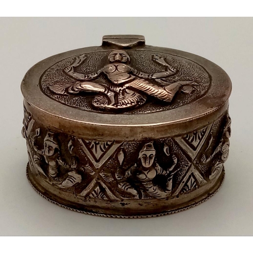 391 - An Antique Burmese Solid Silver Snuff or Pill Box. Wonderful embossing decoration throughout. Good c... 