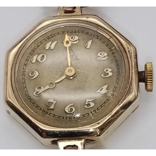 401 - A 14K Gold-Cased Ladies Watch. Mechanical movement. 
Case -20mm. In working order but because of age... 