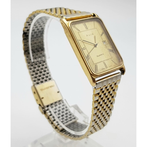 53 - A Vintage Avia 9K Gold Cased Watch. Gilded strap. Gold rectangular case - 33 x 23mm. Dial is worn on... 