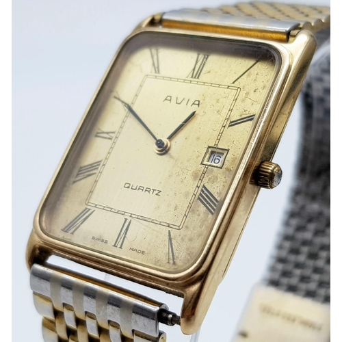 53 - A Vintage Avia 9K Gold Cased Watch. Gilded strap. Gold rectangular case - 33 x 23mm. Dial is worn on... 