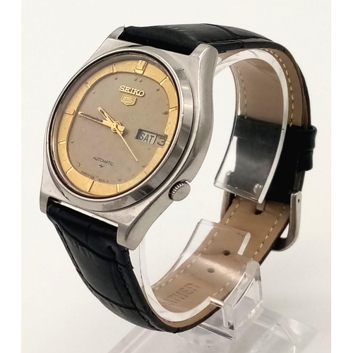 145 - A Vintage Seiko 5 Automatic Gents Watch. Black leather strap with two tone metal case - 34mm. Two-to... 