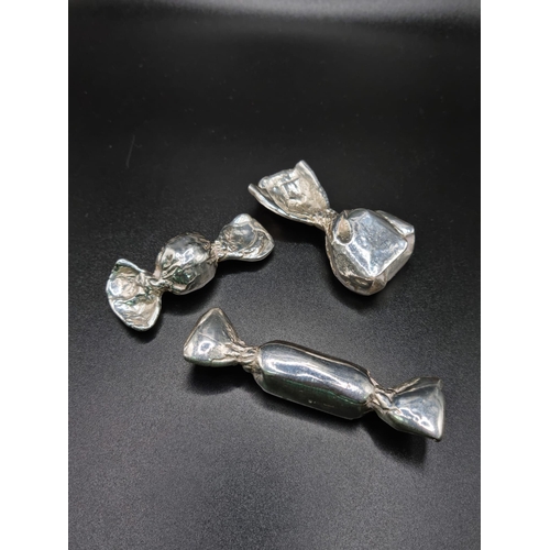 569 - Three vintage solid silver candy sweets. 6cm, 6cm, 7.5cm. Total weight: 40.5 grams.