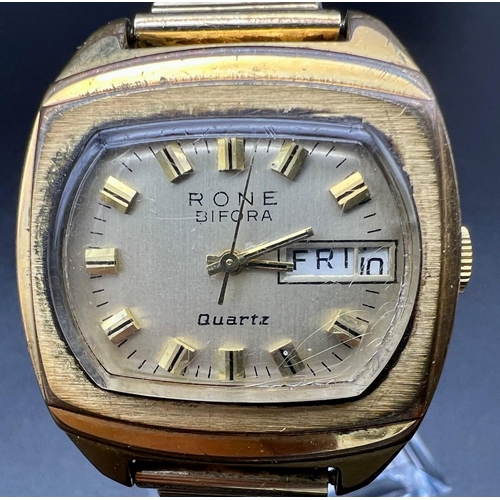 124 - A Vintage Rone Bifora Gents Watch. Expandable strap and two-tone metal case - 45mm. Gilded dial with... 