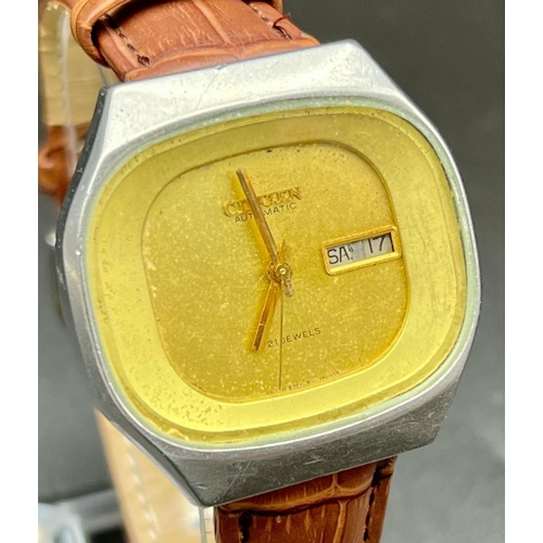 143 - A Vintage Citizen 21 Jewel Automatic Gents Watch. Leather strap. Case - 36mm. Gilded dial with day a... 