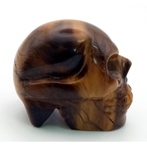 90 - A Hand-Carved Tigers Eye Crystal Skull Figure. Perfect as an ornament or small paperweight. 5 x 4cm