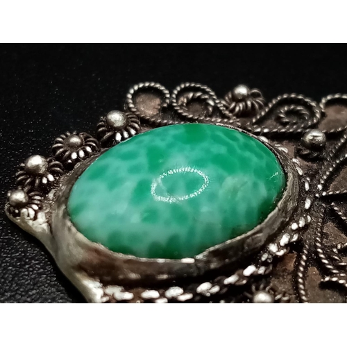 680 - A Vintage Turquoise and Silver Pendant. 4cm.