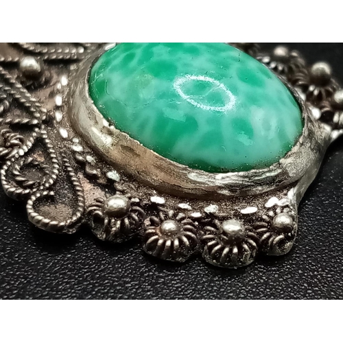 680 - A Vintage Turquoise and Silver Pendant. 4cm.