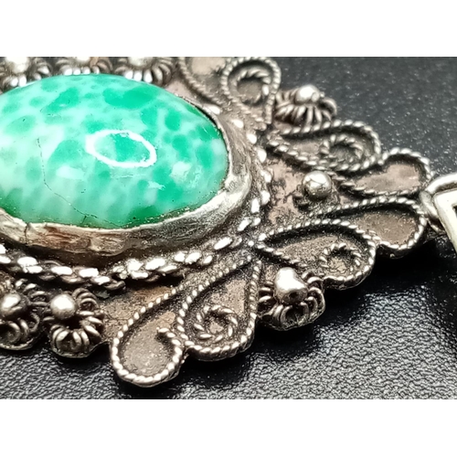 680 - A Vintage Turquoise and Silver Pendant. 4cm.