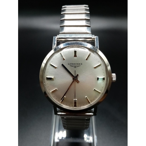 96 - A Classic 1970s Longines Gents Watch. Fitted with a speidel expandable stainless steel strap for add... 