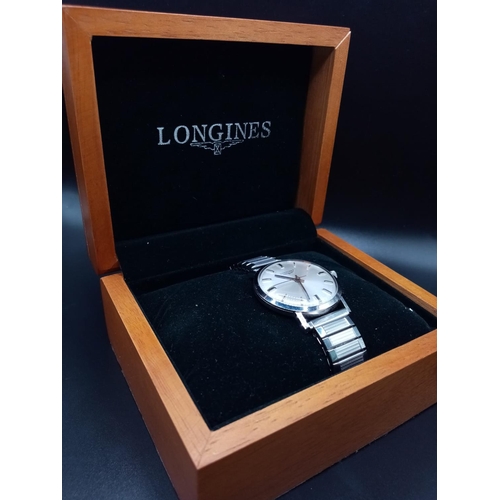 96 - A Classic 1970s Longines Gents Watch. Fitted with a speidel expandable stainless steel strap for add... 