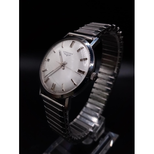 96 - A Classic 1970s Longines Gents Watch. Fitted with a speidel expandable stainless steel strap for add... 