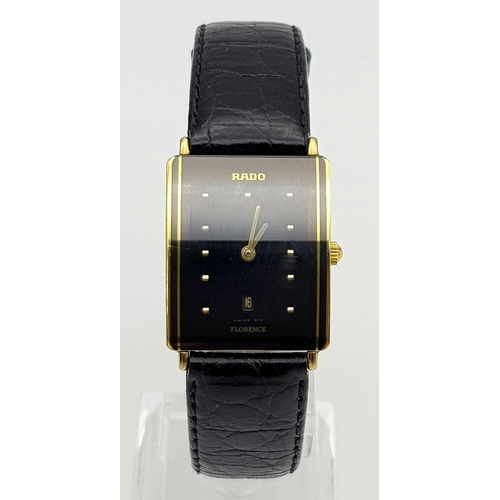 186 - A Rado Florence Ladies Watch. Black leather strap with two-tone case - 30 x 22mm. Black dial with da... 