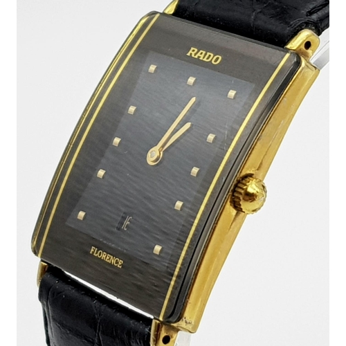 186 - A Rado Florence Ladies Watch. Black leather strap with two-tone case - 30 x 22mm. Black dial with da... 