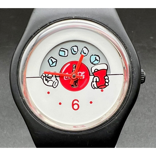 463 - A Rare Coca Cola Quartz Watch with Moving Ice Cubes!
In good condition and working order.