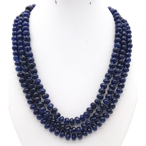 104 - A substantial three strand multifaceted blue sapphire necklace. Length: 48-54 cm, weight: 112g.