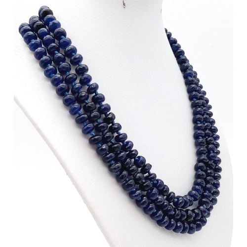 104 - A substantial three strand multifaceted blue sapphire necklace. Length: 48-54 cm, weight: 112g.