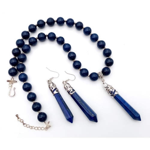 125 - A very noticeable lapis lazuli necklace and earrings set with large obelisk pendants. Necklace lengt... 