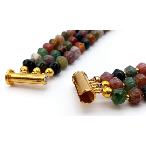 181 - A three strand, multicoloured, Malaysian jade necklace and earrings set with Chinese gilded accents.... 