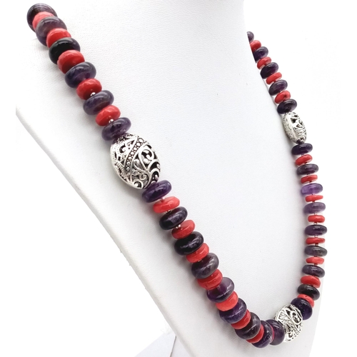 230 - A fabulous necklace and earrings set, with rondelle shaped amethysts and red coral. Necklace length:... 