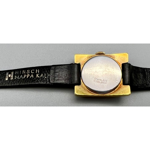 484 - A Vintage Emka Ladies Watch. Leather strap with a square gilded case - 22mm. Mechanical movement. In... 