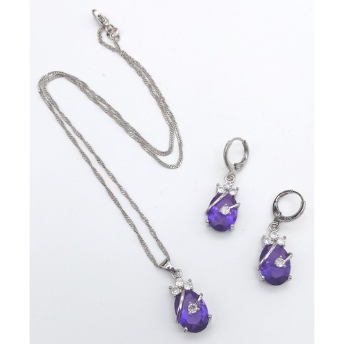 447 - A 925 Silver, Purple and White Stone Pendant and Earring Set. Pendant comes on a 925 silver necklace... 