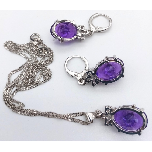 447 - A 925 Silver, Purple and White Stone Pendant and Earring Set. Pendant comes on a 925 silver necklace... 