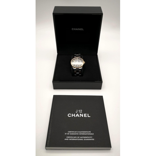 60 - A Chanel Black J12 Ceramic Ladies Watch. Black ceramic strap. Ceramic and rose gold case - 36mm. Bla... 