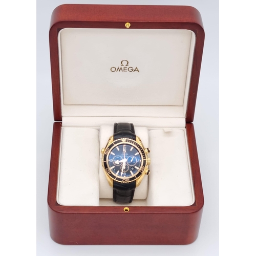 99 - An Omega Seamaster Planet Ocean 600M Co-Axial Chronograph 18K Gold Gents Watch. Black leather and ro... 