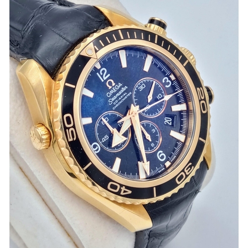 99 - An Omega Seamaster Planet Ocean 600M Co-Axial Chronograph 18K Gold Gents Watch. Black leather and ro... 