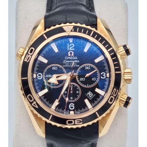 99 - An Omega Seamaster Planet Ocean 600M Co-Axial Chronograph 18K Gold Gents Watch. Black leather and ro... 