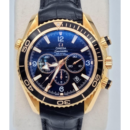 99 - An Omega Seamaster Planet Ocean 600M Co-Axial Chronograph 18K Gold Gents Watch. Black leather and ro... 