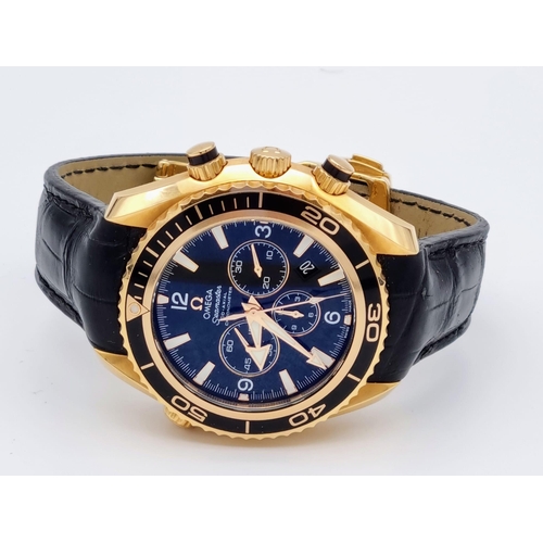 99 - An Omega Seamaster Planet Ocean 600M Co-Axial Chronograph 18K Gold Gents Watch. Black leather and ro... 