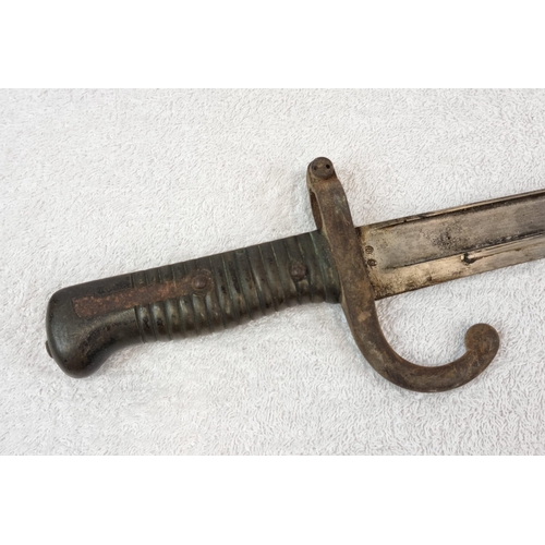 387 - An Antique 1870s Mauser Rifle Bayonet and Scabbard.
69cm total length.