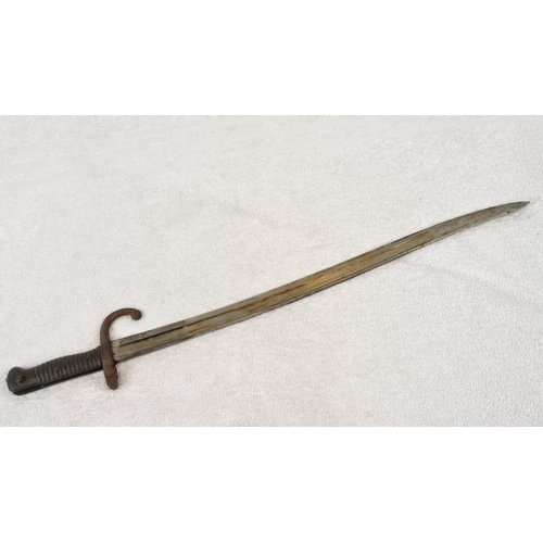 387 - An Antique 1870s Mauser Rifle Bayonet and Scabbard.
69cm total length.