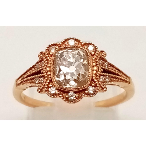 103 - A VINTAGE STYLE 18K ROSE GOLD CUSHION CUT DIAMOND RING WITH LARGE CENTRE DIAMOND AND DIAMOND SURROUN... 