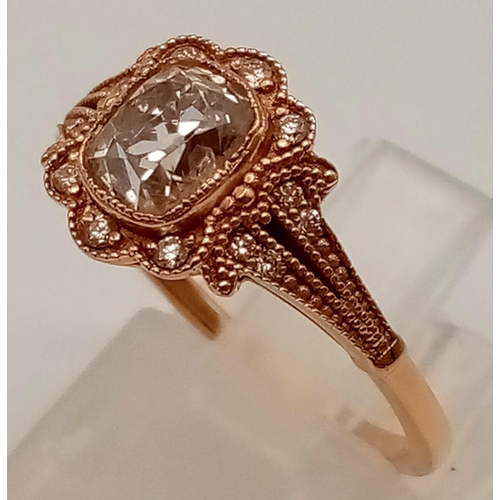 103 - A VINTAGE STYLE 18K ROSE GOLD CUSHION CUT DIAMOND RING WITH LARGE CENTRE DIAMOND AND DIAMOND SURROUN... 