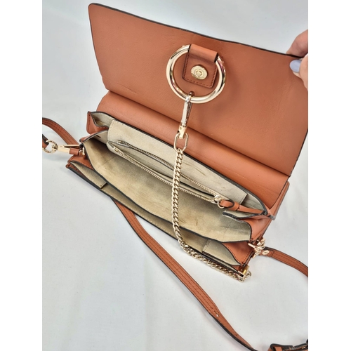 194 - A Chloe Brown Leather and Suede Shoulder Bag. Brown leather exterior with suede flap. Leather strap ... 