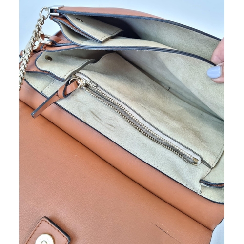 194 - A Chloe Brown Leather and Suede Shoulder Bag. Brown leather exterior with suede flap. Leather strap ... 