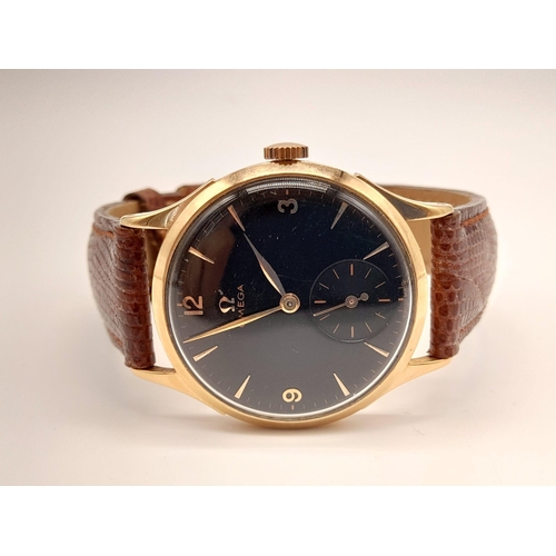 270 - A Vintage 18k rose gold Omega Gents Watch. Leather strap with rose gold case - 36mm. Black dial with... 