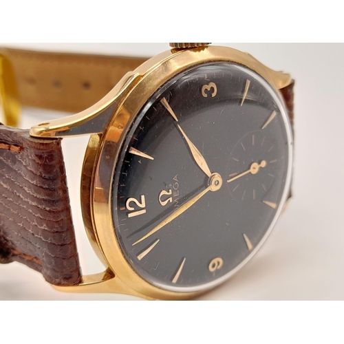 270 - A Vintage 18k rose gold Omega Gents Watch. Leather strap with rose gold case - 36mm. Black dial with... 