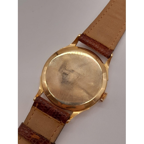 270 - A Vintage 18k rose gold Omega Gents Watch. Leather strap with rose gold case - 36mm. Black dial with... 