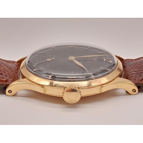 270 - A Vintage 18k rose gold Omega Gents Watch. Leather strap with rose gold case - 36mm. Black dial with... 