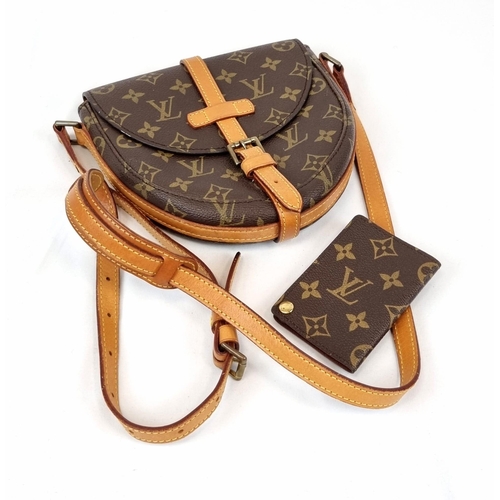 311 - A Louis Vuitton Saddle Crossbody Bag. Monogrammed brown canvas and leather exterior. Zipped interior... 