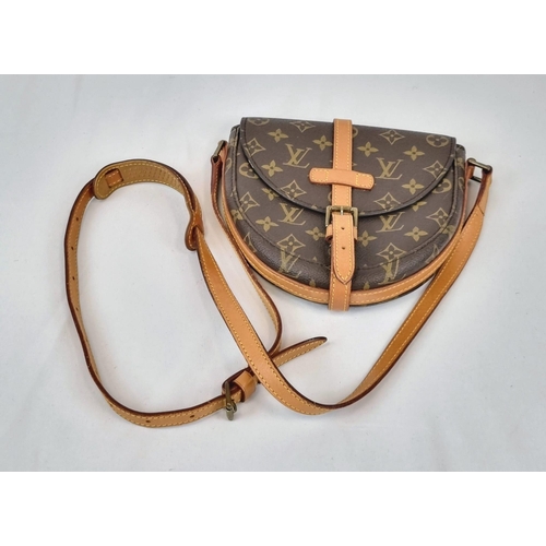 311 - A Louis Vuitton Saddle Crossbody Bag. Monogrammed brown canvas and leather exterior. Zipped interior... 