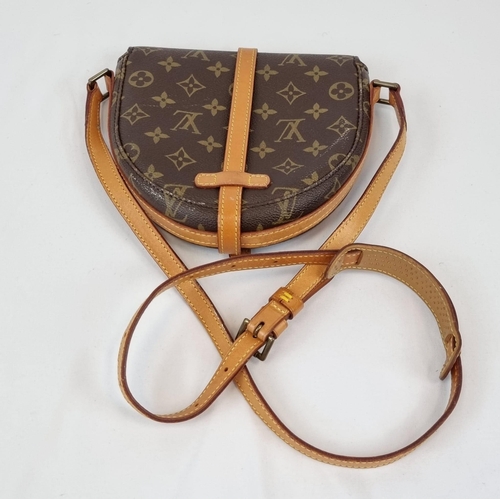 311 - A Louis Vuitton Saddle Crossbody Bag. Monogrammed brown canvas and leather exterior. Zipped interior... 