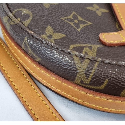 311 - A Louis Vuitton Saddle Crossbody Bag. Monogrammed brown canvas and leather exterior. Zipped interior... 